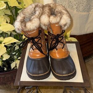 Winter boots by juicy couture, size 5. All man-made materials.